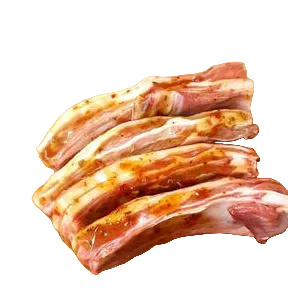Raw lamb Ribs on a wooden cutting board