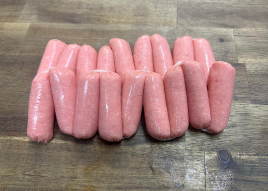 Beef Chipolata Sausages 2kg pack displayed on a wooden surface, showcasing their fresh and juicy appearance.
