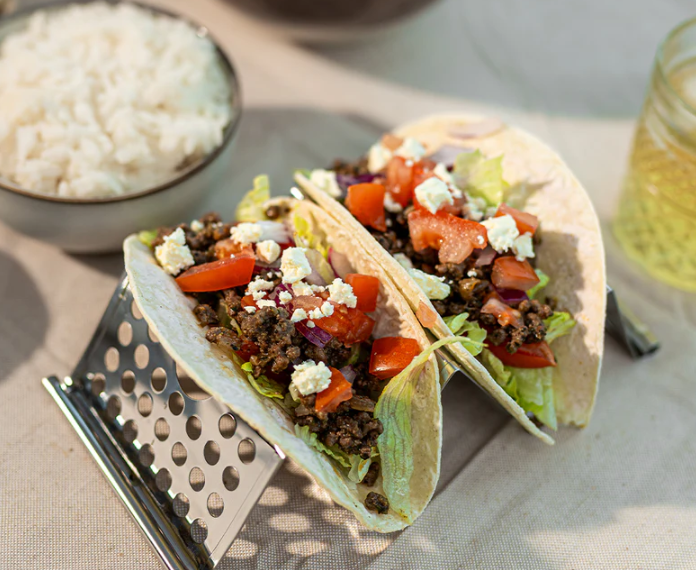 Delicious tacos with fresh toppings served with rice, featuring Lane's Zesty Tex Mex Taco Recipe Base.