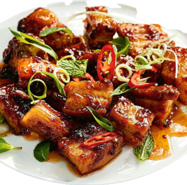 Pork Belly Bites garnished with herbs and spices, featuring a Chilli Garlic Marinade for a flavorful dish.