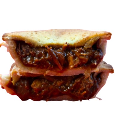 Texan BBQ Pork Pie 240g showing a delicious, pulled pork filling inside a golden crust, perfect for individual servings.