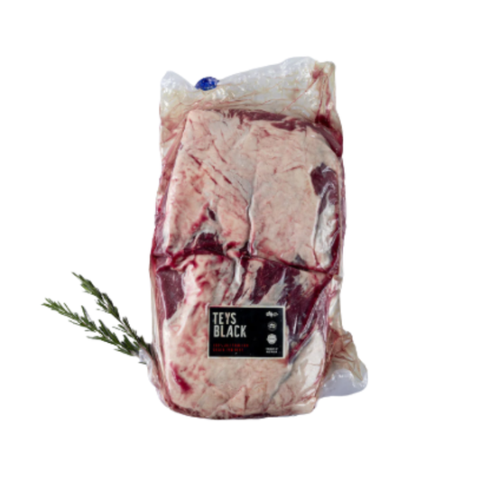 Teys Black Short Ribs MB2+ packaged with rich marbling and a sprig of rosemary for flavor enhancement.